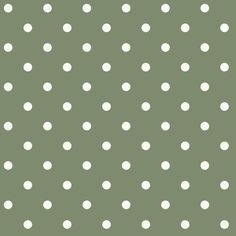 a green background with white polka dots