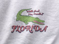 Show off your Florida pride with our Florida Shirt, designed for both locals and vacationists alike! This Florida T-shirt by Grumpy Dad Co. is the ultimate way to represent the Sunshine State, whether you're a proud Floridian or simply looking for the perfect Florida souvenir. 🌴 Unique Design: Featuring a creative and eye-catching design, our Florida State Tee embodies the vibrant spirit of Florida. Stand out from the crowd and make a bold statement as you flaunt your love for this beautiful st Florida Graphic Tee, Floridian Outfits, Florida Shirts, Florida Tshirt, Florida Outfits, Travel Apparel, Florida Shirt, Florida Design, Adventure Outfit