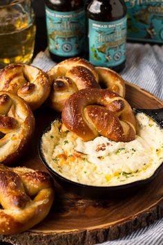 some pretzels are sitting on top of mashed potatoes in a cast iron skillet