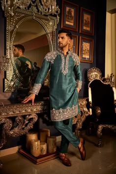 Neelahat Elevate your style quotient with the timeless elegance of Angad Creations' Men's Embroidered Kurta Pajama. Crafted from Pure Raw Silk, this ensemble is more than just attire; it's a heritage statement, exuding sophistication for a dashing ethnic appeal. Ideal for weddings, parties, or any celebratory affair, this outfit encapsulates tradition and class in every stitch, ensuring you stand out with refined charm. Product Details - Condition: Brand New (made to order) - Style: Kurta Pajama Kashmiri Tilla Embroidery, Raw Silk Kurta, Captain America Suit, Tilla Embroidery, Kurta Men, Silk Kurta, Kurta Pajama, Blue Embroidery, Silk Embroidery