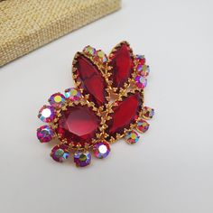 "Beautiful vintage brooch with open back red stones in dogtooth prongs. Made is Czechoslovakia in 1960s,  in excellent condition. Size: 1 1/2\" by 2 1/4\"." Vintage Red Czech Glass Jewelry, Vintage Brown Brooch Jewelry, Handmade Vintage Red Brooches, Vintage Red Enamel Brooches, Antique Red Brooch, Czech Jewelry, Red Stones, Vintage Designer Jewelry, Jewelry Ads