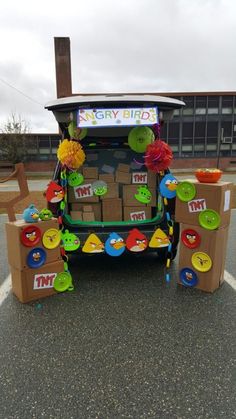 a vehicle decorated with cardboard boxes and decorations