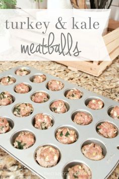 turkey and kale meatballs in a muffin tin on a granite countertop