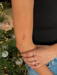 A fine line tattoo with two starbursts Cute Red Heart Tattoo, Tiny Starburst Tattoo, Starburst Tattoo Stars, Danty Tattoos Women, Heart Rib Tattoo, Two Stars Tattoo, Star Sparkle Tattoo, Red Small Tattoos, Simple Dainty Tattoos