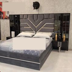 a large bed sitting inside of a bedroom next to a night stand with two nightstands