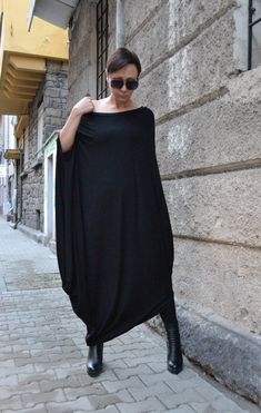 "Be wonderful with this beautiful Zen tunic dress. So light and pleasant to wear. Change shoes and jewelry and will change the fashion style. BE DIFFERENT! BE UNIQUE! BE FEMININE! It's so easy with this amazing top. This tunic dress is treasure in your wardrobe. SMILE! HEIGHT OF MODEL: 168 cm. / 5′ 6″ Size S All garments are handmade. Please provide your PHONE NUMBER for delivery EXPRESS delivery for ALL ORDERS Accessories are not for sale. If you have different measurements please inform us. SI Black Batwing Sleeve Evening Dress, Black Evening Dress With Batwing Sleeves, Elegant Black Batwing Sleeve Dress, Oversized Tunic Dress In Lagenlook Style, Black Lagenlook Tunic Dress, Evening Maxi Dress With Batwing Sleeves, Oversized Long Dress For Party, Oversized Long Dresses For Party, Long Oversized Dresses For Parties