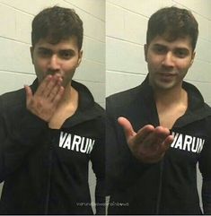 a man in a black hoodie is making the vulcan sign with his hands while standing in front of a mirror