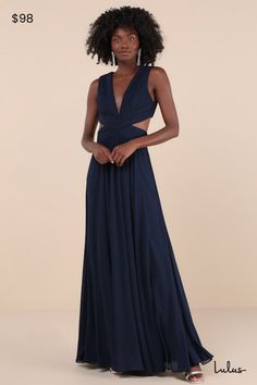 Even your wildest dreams can come true in the Lulus Vivid Imagination Navy Blue Cutout Maxi Dress! Pleated chiffon sweeps into a plunging V-neckline and fitted bodice, while a crisscrossing waist transitions into sexy side cutouts that wrap the back. Full, flowing maxi skirt completes the look. Hidden back zipper/clasp at the top and at the skirt. Fit: This garment fits true to size. Length: Floor length. Size medium measures 61" from shoulder to hem. Bust: Works best for A to C cup sizes - consider sizing up for fuller bust. Waist: Fitted - very fitted at natural waist. Hip: Not Fitted - room for hips. Undergarments: May be worn with petals, or no bra. Fabric: Fabric has no stretch. Fully lined. Shell: 100% Polyester. Lining: 100% Polyester. Hand Wash Cold. Do Not Bleach. Line Dry. Iron L Cutout Dress Formal, Navy Blue Dress Wedding, Prom Dress Shops, Dress Shops, Cutout Gown, Navy Blue Maxi Dress, Cutout Maxi Dress, Dress Pleated, Formal Dresses Gowns