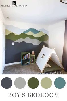 a bedroom with mountains painted on the wall and a tent bed in the corner, next to a book shelf