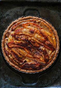 a pie sitting on top of a metal pan