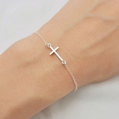 ALL SOLID 925 STERLING SILVER - A QUALITY BRACELET I make this lovely bracelet using a solid sterling silver cross that measures just under 3/4 inch long. A sturdy sterling silver chain and lobster clasp make this a durable bracelet. Makes a wonderful layering bracelet when paired with my other pieces. Comes in a gift box perfect for gift giving. SIZING - IMPORTANT: To determine bracelet size, measure snugly around your wrist and add 1/2 inch. If you don't know your size, you can use the sizing Silver Cross Bracelet, Cross Gift, Tiny Cross, First Communion Gifts, Bracelet I, Confirmation Gifts, Long A, Cross Bracelet, Layered Bracelets