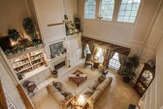 an aerial view of a living room with high ceilings