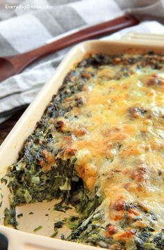 a casserole dish filled with spinach and cheese