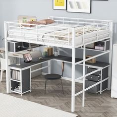 a white loft bed with desk underneath it