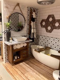 a bathroom with a tub, sink and mirror