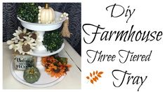 three tiered tray with flowers and pumpkins on it, next to a sign that says diy farmhousehouse