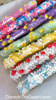 six different colored bracelets with stars and confetti on them, all labeled in the following words