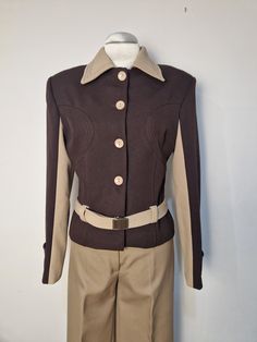 Vintage 1970s jacket in bicolore, Brown nd beige, with buttons and original belt, in very good condition!  Shoulder 42 cm Bust 47 cm Total lenght cm 52 Luxury 1970s Style Brown Outerwear, Retro Single Breasted Beige Blazer, Retro Single-breasted Beige Blazer, Retro Beige Single Breasted Blazer, Fitted Beige Retro Blazer, Retro Beige Single-breasted Blazer, Vintage Beige Outerwear For Office, Retro Beige Outerwear For Formal Occasions, Retro Beige Formal Outerwear