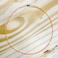 Approximately 15 inches long Made with seed beads on silver wire to prevent wear Spring ring closure stackable and dainty Adjustable Pink Beaded Necklaces With Silver Beads, Adjustable Pink Beaded Necklace With Silver Beads, Dainty Yellow Jewelry With Tiny Beads, Adjustable Dainty Beaded Necklace With Spacer Beads, Dainty Adjustable Bracelet With Tiny Beads, Adjustable Silver Heishi Beads Necklace, Dainty Adjustable Beaded Chain Necklaces, Dainty Silver Beaded Necklaces, Minimalist Adjustable Silver Beaded Necklaces