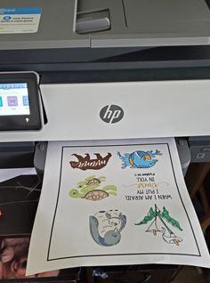 an hp printer with stickers on it's side and the screen showing its print capabilities