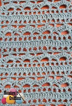 a crocheted afghan with holes in the middle