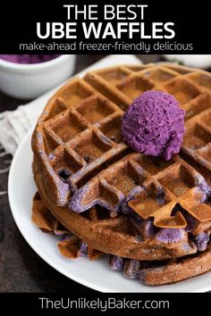 a stack of waffles on a plate with purple ice cream in the middle