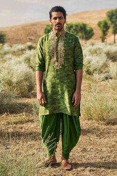 Kacha aam printed kurta with contrast marodi and dabka embroidered placket and collar. Comes with cowl pant.
Components: 2
Pattern: Printed, Embroidered
Type Of Work: Marodi, Dabka
Neckline: Mandarin
Sleeve Type: Long
Fabric: Chanderi Silk, Satin Silk
Color: Green
Other Details: 
Closure: Kurta: Button placket
Occasion: Mehendi and Puja,Sangeet - Aza Fashions Punit Balana, Indian Groom Wear, Gents Kurta Design, Gents Kurta, Kurta Set For Men, Indian Groom, Groom Wear, Silk Embroidery, Kurta Designs