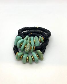 "This listing is for 1 bracelet made with Black African clay discs and turquoise chip beads. My hand-beaded bracelets are made with stretch elastic which makes it comfortable and easy to wear. My bracelets are made to fit an average wrist size of 6.5\"-7\". Take a look around my shop for additional colors to add to your stack! The more the better!" Turquoise Beaded Bracelets With Black Beads, Handmade Black Heishi Beads Stretch Bracelet, Spiritual Stackable Turquoise Stretch Bracelet, Adjustable Turquoise Stretch Bracelet With Natural Stones, Bohemian Turquoise Stretch Bracelet With Heishi Beads, Bohemian Turquoise Heishi Beads Stretch Bracelet, Black Bohemian Stretch Bracelet Stackable, Black Bohemian Stackable Stretch Bracelet, Bohemian Black Stackable Stretch Bracelet