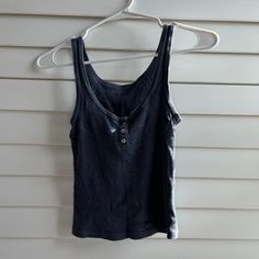 Brandy Melville Three Button Navy Tank Top Condition: Brand New, Never Worn, Tags Removed - As Shown In Image - All Prices Are Firm All Questions And Concerns Are Welcome! **All Items Final Sale** Casual Cotton Tank Top With Button Closure, Casual Cotton Tank Top With Buttons, Fitted Blue Tank Top With Button Closure, Casual Black Tank Top With Button Closure, Blue Cotton Buttoned Tank Top, Everyday Sleeveless Tops With Buttons, Sleeveless Tops With Buttons For Everyday, Everyday Blue Tops With Buttons, Brandy Melville Aesthetic