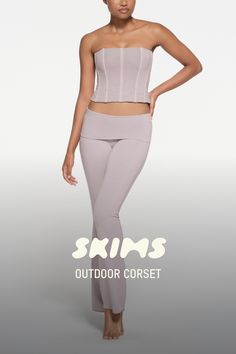 Elevate your off-duty look in this comfortable corset that shapes your figure with flexible boning. Features a worn-in look and exposed back zipper. Pair with the Outdoor High Waist Legging for a flattering set. Fits true to size. This garment has undergone a special wash process which may result in variations in shading and color. These variations are intentional and add to the unique characteristics of this garment. The coloring may rub off on light colored fabrics and upholstery. Wash before Corset Purple, Unique Characteristics, Swimsuit Cover Ups, Swimsuit Cover, Holiday Fashion, High Waisted Leggings, Tank Dress, Shirt Shop