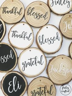 wood slice ornaments with handwritten names on them