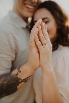 a man and woman are holding hands together