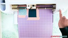 someone is using a sewing machine to sew fabric on the back of a quilt