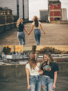 two girls are holding hands and laughing while standing in an empty parking lot with buildings behind them