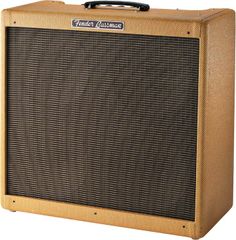 the fender guitar amplifier is brown and has a black cover on it's side