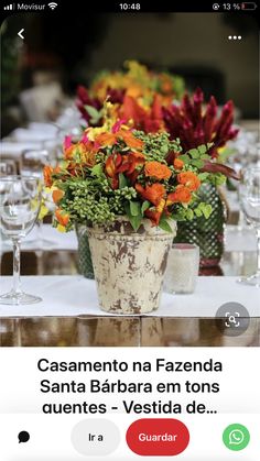 a table with flowers and wine glasses on it, in the middle of an instagram page