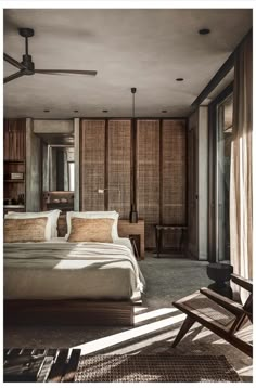 a bed sitting in a bedroom next to a wooden dresser and window with blinds on it