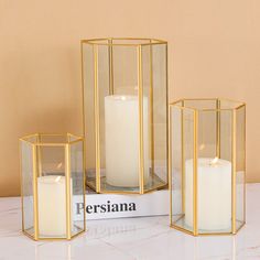 PRICES MAY VARY. 【Home Wedding Decor & Gift 】The transparent glass shade of candle holder, along with gold metal frame, simple design is suitable for many occasions, like wedding, anniversary, Christmas, Valentine etc., also a great choice for gifts and home decor 【Elegant Home Decoration】Illuminate any space with this set of 3 hurricane candle holders, featured in a geometric design to transform your living space with its refined, rustic look and provides the right ambiance for any occasion 【Qu Glass Candle Lantern, Modern Lanterns, Gold Candle Holders, Cosmoliving By Cosmopolitan, Fantasy Land, Centerpiece Table, Modern Candles, Lantern Set, Candle Lantern