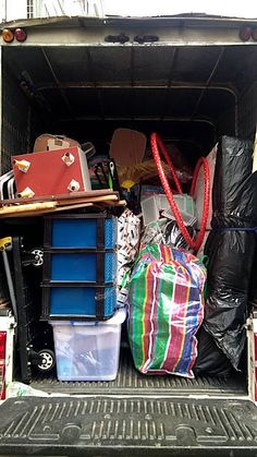 the back end of a truck filled with various items