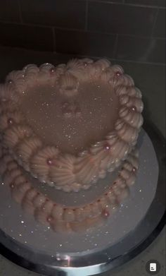 a heart shaped cake sitting on top of a white plate