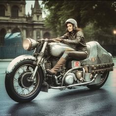 a man riding on the back of a motorcycle down a rain soaked street in front of an old building