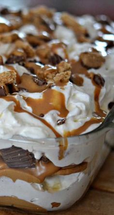 a dessert dish with chocolate, marshmallows and caramel drizzle