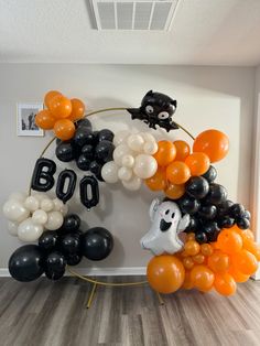 balloons are arranged in the shape of boos and ghost heads