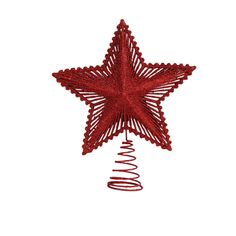 a red star ornament hanging on a white wall