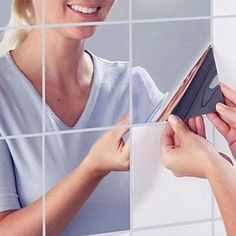 a woman is holding a book in her hands