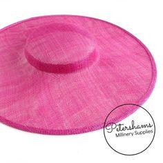 This cerise pink cartwheel hat base is a classic shape that has sprung into popularity in the past year. Made from 2 layers of stiffened sinamay, these cartwheels are ready to trim and are fitted with a petersham ribbon on the inside crown edge. Simply add a comb or headband to secure to the head.Hat base measures:Width: 35.5cm (14 inches)Crown Width: 13.5cm (5.3 inches)Crown Height: Approximately 3.5cm (1.7 inches)For even more millinery supplies you can find us here:www.etsy.com/shop/Petersham Adjustable Cloche Fascinator For Beach, Adjustable Pink Cloche Fascinator, Pink Adjustable Cloche Fascinator, Pink Adjustable Fascinator With Short Brim, Adjustable Pink Fascinator For Church, Pink Cloche Mini Hat For Summer, Pink Wide Brim Fascinator For The Beach, Fitted Pink Hat With Curved Brim, Pink Brimmed Mini Hat, One Size