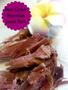 slow cooker hawaiian sweet pork on a white plate with a flower in the background