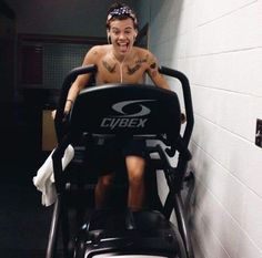 a man sitting on top of a stationary exercise bike