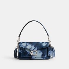 A modern take on an archival 1970s Coach design, our structured Tabby shoulder bag is crafted of smooth leather printed with our sophisticated spin on a classic tie-dye pattern. Smaller than the 26, the petite 20 features two detachable straps to carry by hand, style as a short shoulder bag or wear crossbody. It’s finished with our Signature hardware for an iconic touch. Coach Tabby Shoulder Bag, Tabby Shoulder Bag, Coach Tabby, Hand Style, Structured Bag, High Heel Rain Boots, Back Bag, Signature Hardware, Fish Tanks