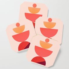 four coasters with abstract shapes on them